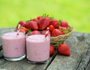 strawberry milk shake on wooden garden table