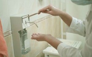 health occupation worker washing her hands