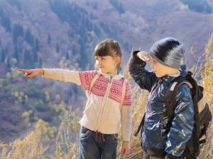 Portrait of hiking caucasian boy and girl