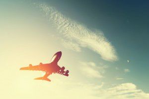 Airplane taking off at sunset. 