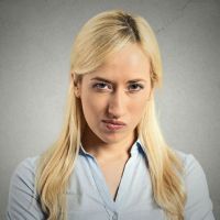 Headshot pissed off, angry, grumpy, young woman