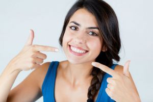 Portrait of beautiful girl with perfect smile. Isolated on white