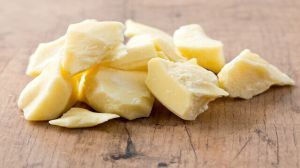 cocoa butter isolated on wooden surface