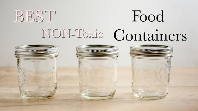 Empty canning jars on a wooden tabletop.