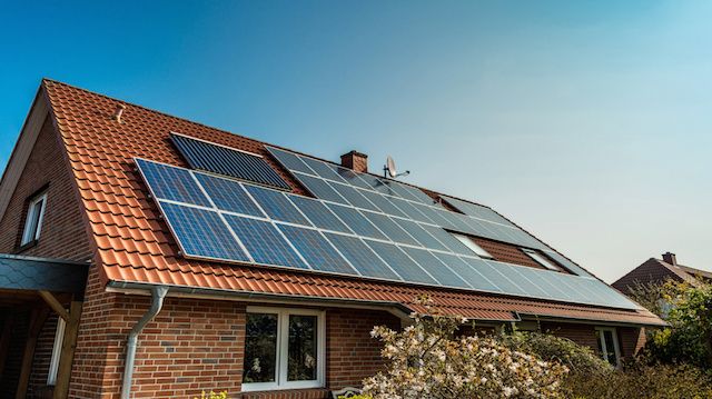 Solar panel on a red roof