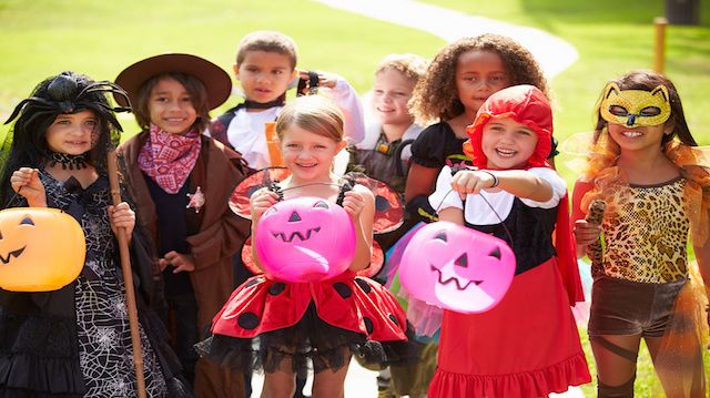 Children In Fancy Costume Dress Going Trick Or Treating