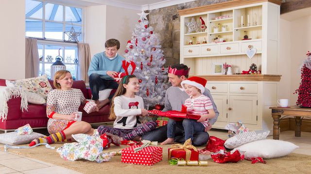 Family opening presents at Christmas Time