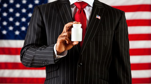 Politician: Holding a Blank Medicine Bottle