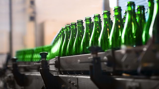 Many bottles on conveyor belt