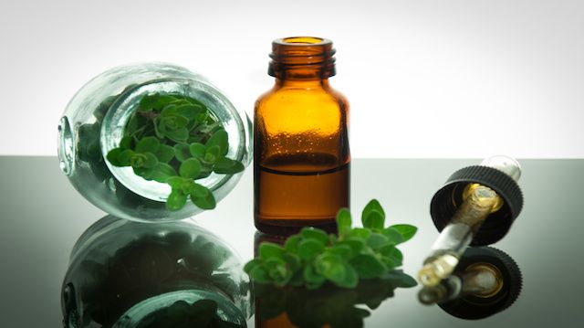 essential oil with oregano leaves