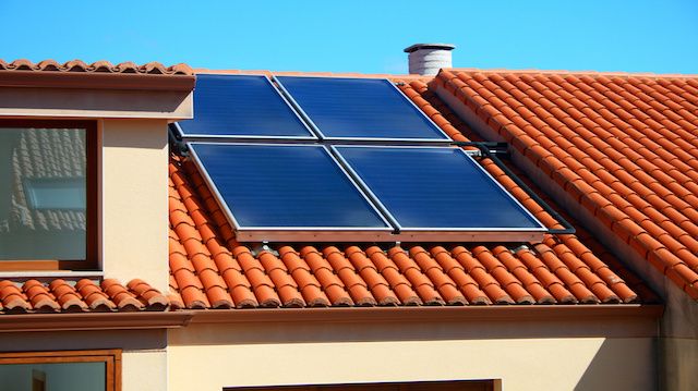 Solar panels over a home roof