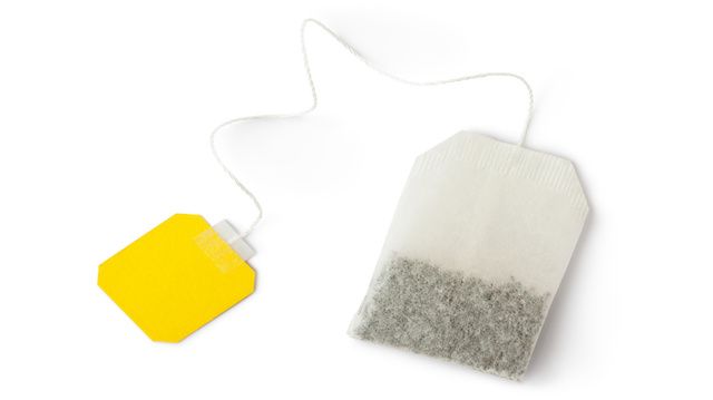 Teabag with yellow label. Top view.