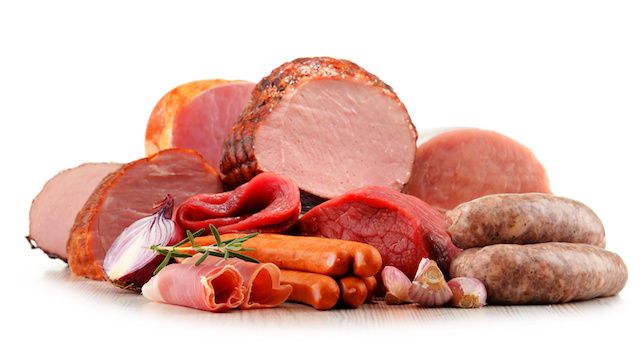 Meat products including ham and sausages isolated on white