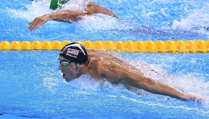 U.S. Olympic swimmer Michael Phelps with visible circular bruises from cupping therapy. (Photo by David Ramos/Getty Images)