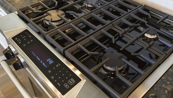 Cleaning behind the stove is important to remove old food, dust and more.