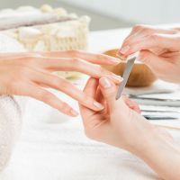 Manicure treatment at nail salon