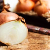 Onions on a rustic wooden table