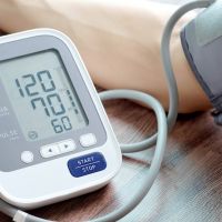 Man check blood pressure monitor and heart rate monitor with digital pressure gauge. Health care and  Medical concept