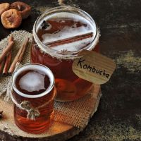 Homemade kombucha with ginger and cinnamon. Recipe cooking kombucha. Fermented beverages. Copy space.